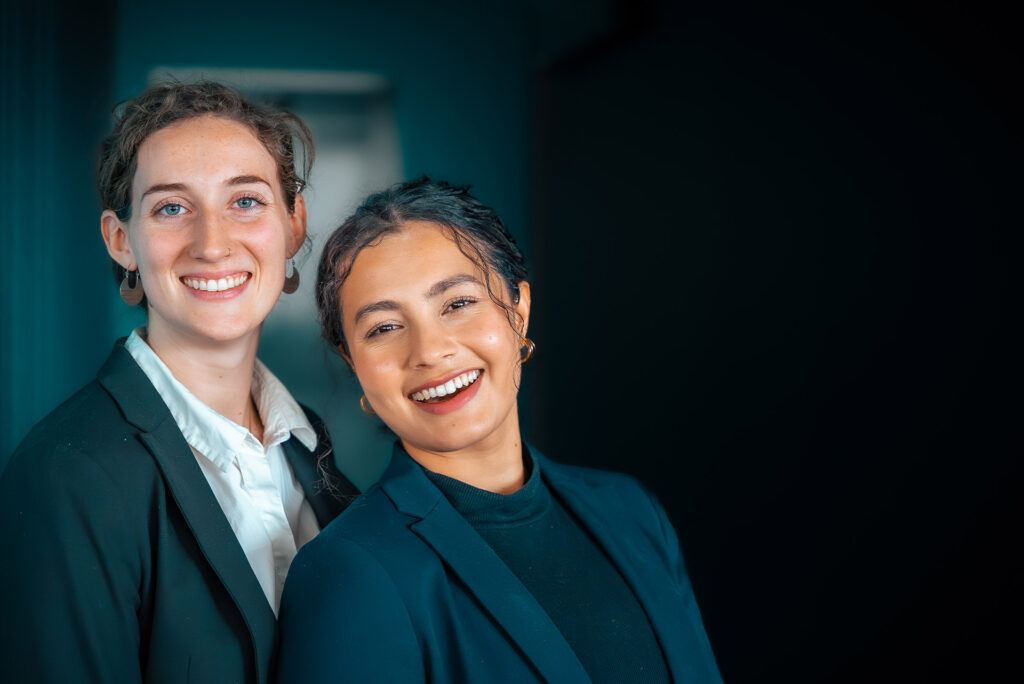 A picture of two Web Manuals employees smiling