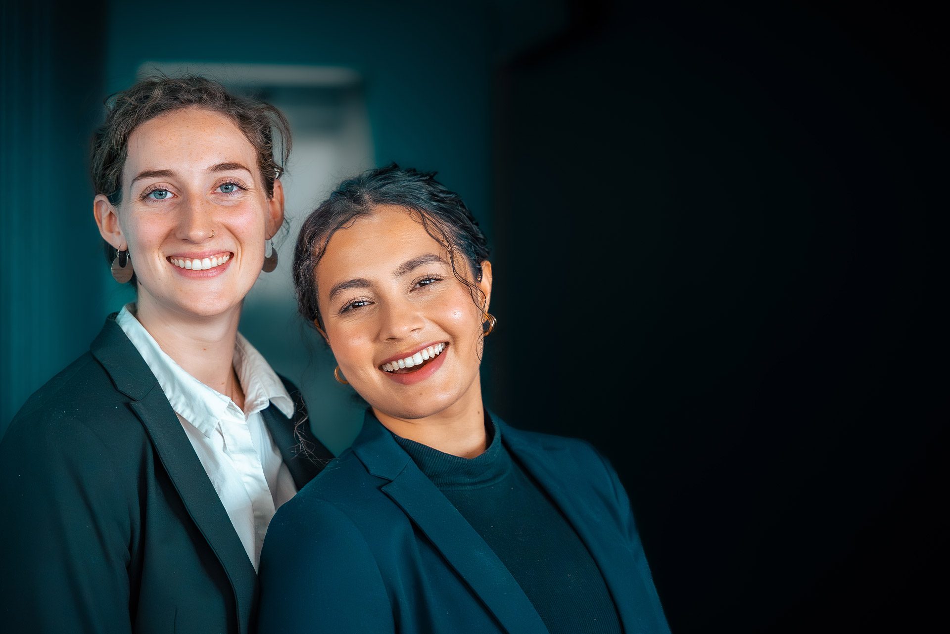 A picture of two Web Manuals employees smiling